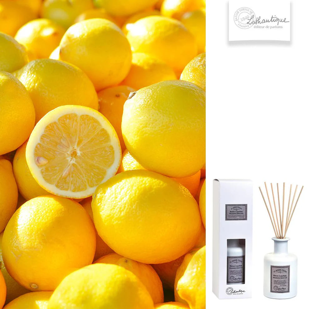Stack of lemons with a Lothantique diffuser set on a white background