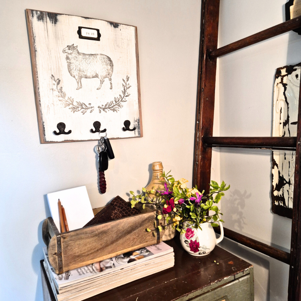 Nostalgic interior with wooden shelf, wall hooks, and decorative items.