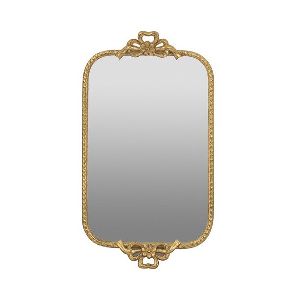 Decorative gold-framed mirror on a white background