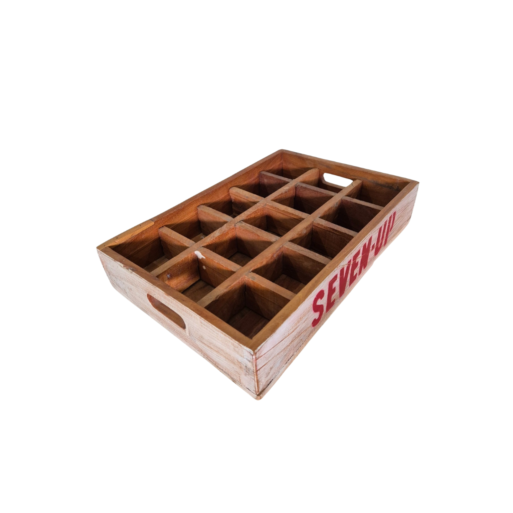 Wooden crate with 'Seven Up' branding on a white background