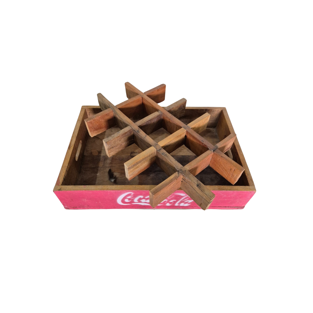 Wooden Coca-Cola bottle holder with a white background