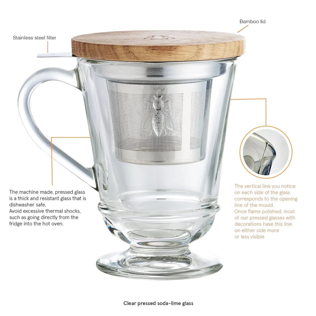 La Rochere Abeille Clear glass mug with bamboo lid and stainless steel filter, featuring text labels on a white background.