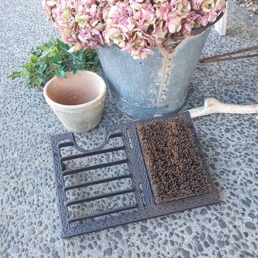 Cast iron shoe scraper with thick brown bristle brush
