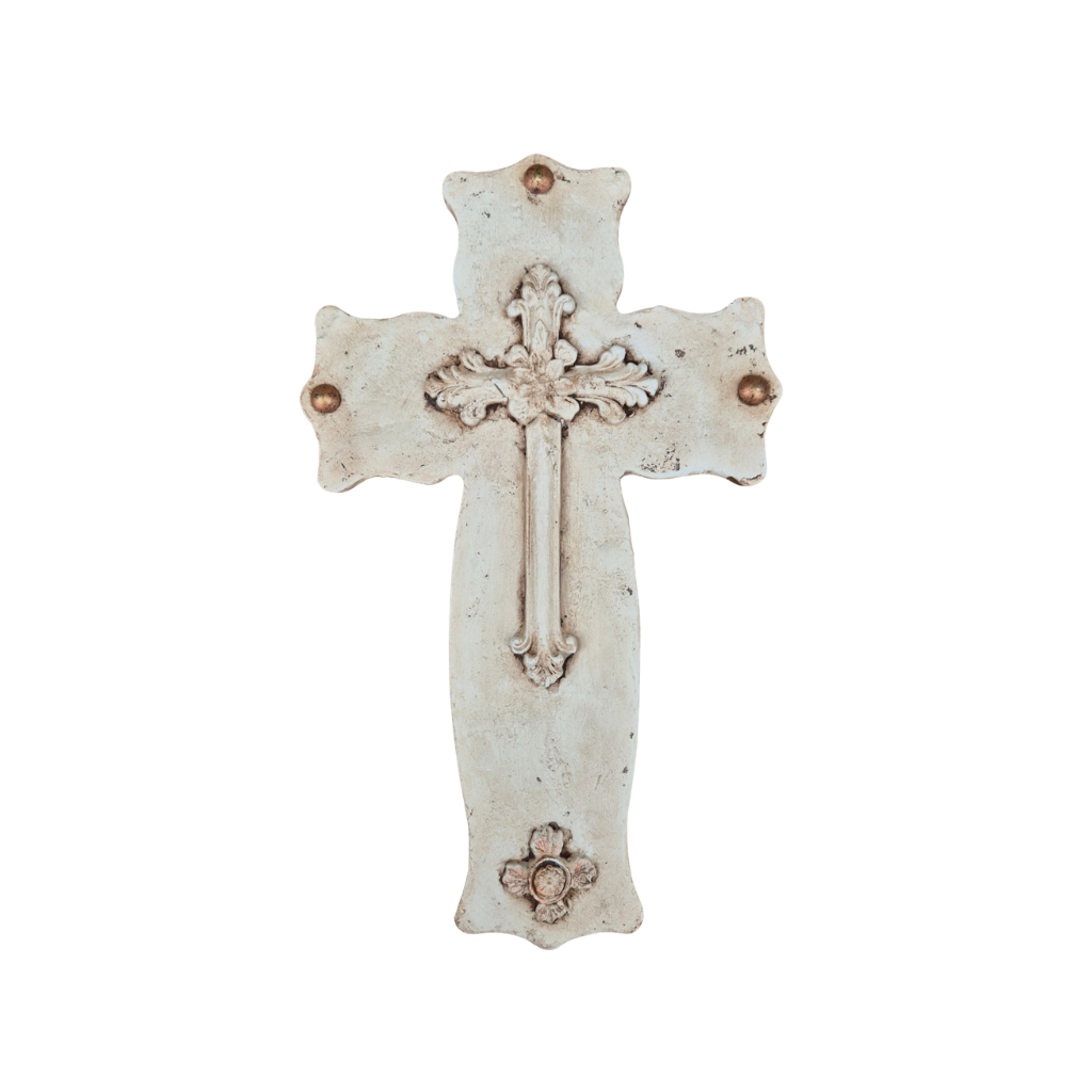 Decorative cross with intricate details on a white background