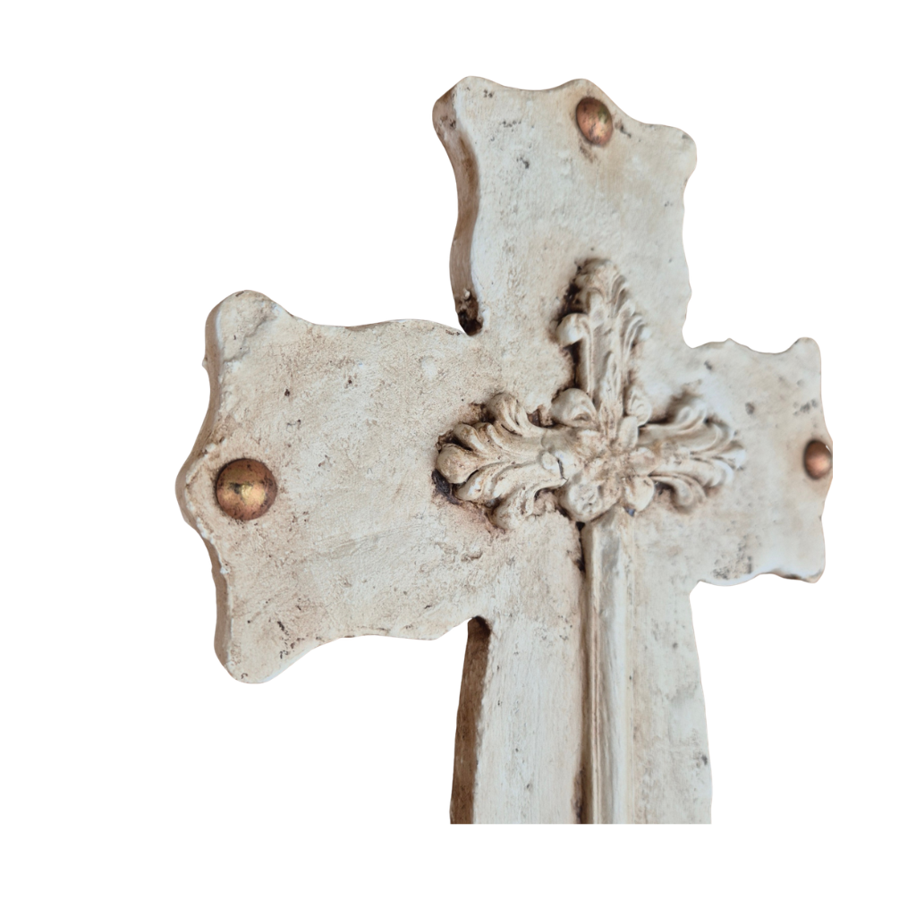 Decorative cross with intricate details on a white background