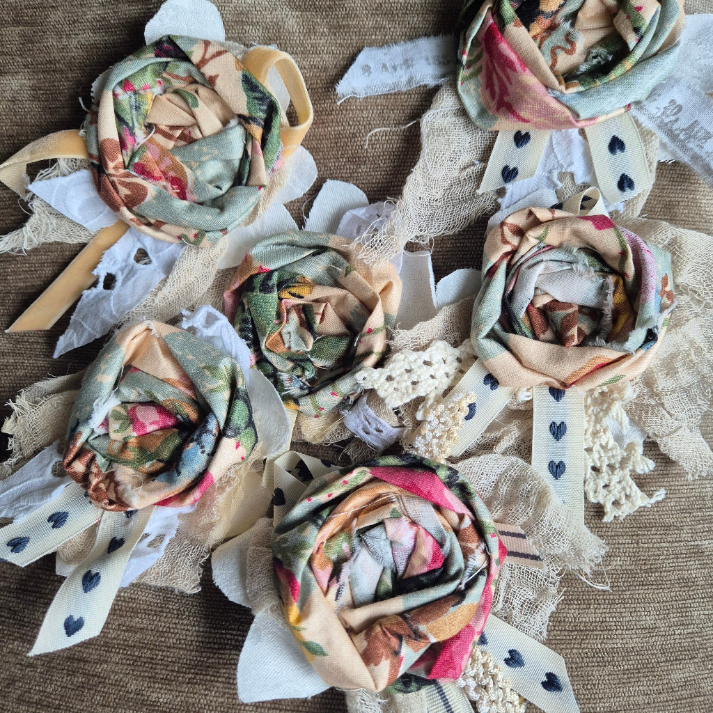 Decorative fabric flowers on a textured surface