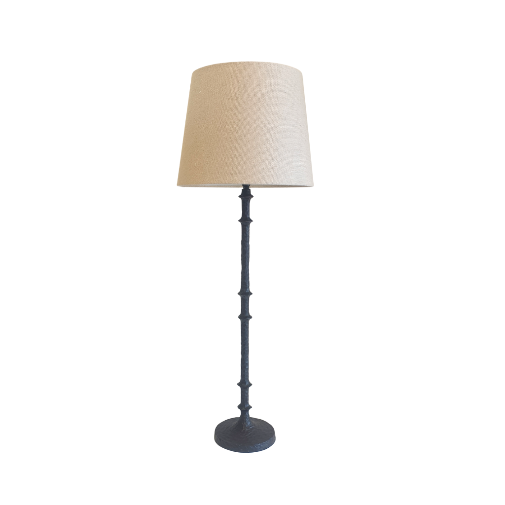 Table lamp with a beige lampshade on a white background