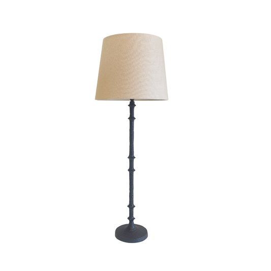 Table lamp with a beige lampshade on a white background