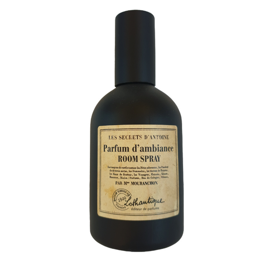 Black line room spray bottle with a label on a white background