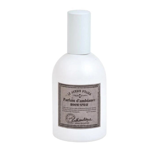 White room spray bottle with a label on a white background