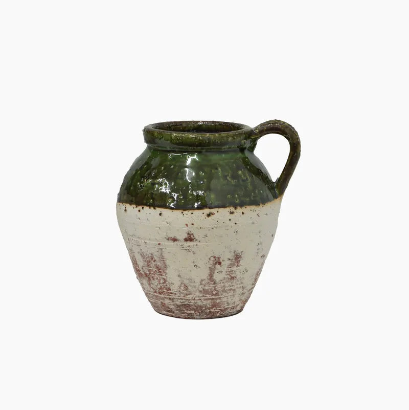 Ceramic vase with green top and white base on a white background