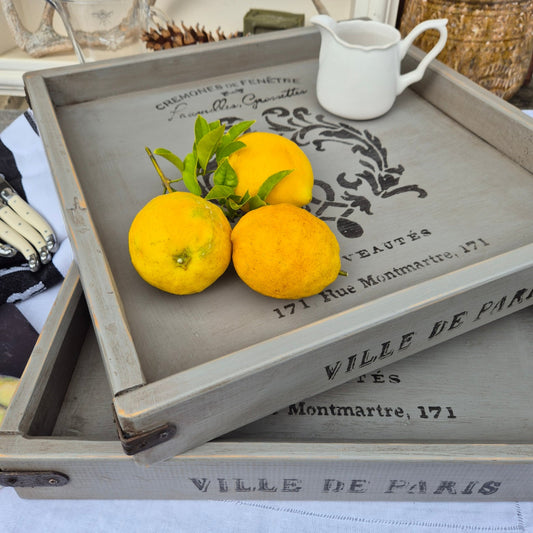 Three lemons on a decorative wooden tray with text