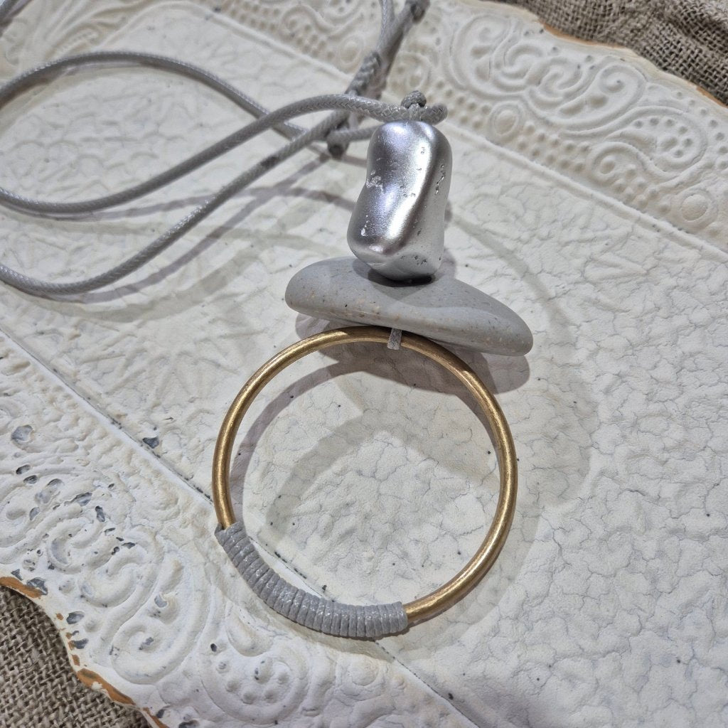 Silver Stone Necklace on white tray