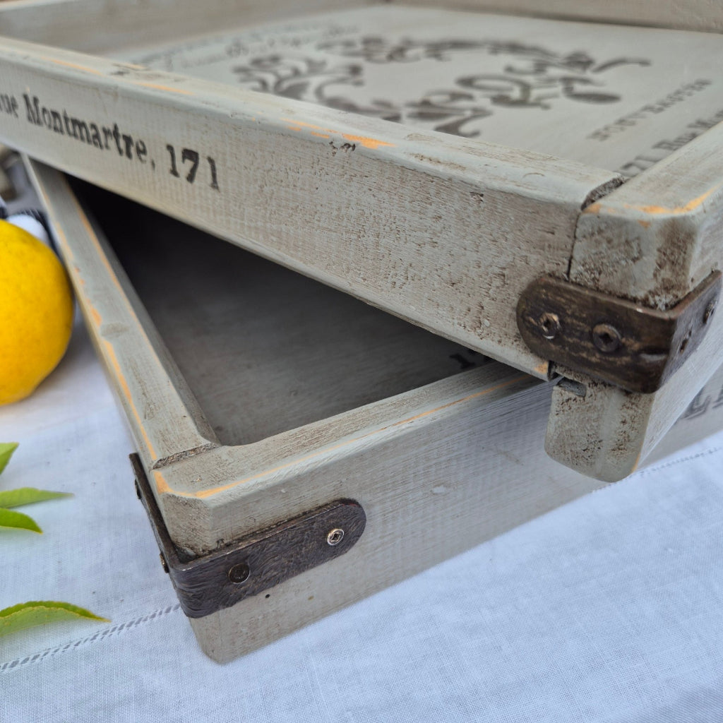 Wooden tray with a lemon on a white background